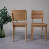 NordicStory Set massief eiken eetkamerstoelen uit de Mauritz collectie Scandinavisch meubilair met een modern eikenhouten ontwerp.